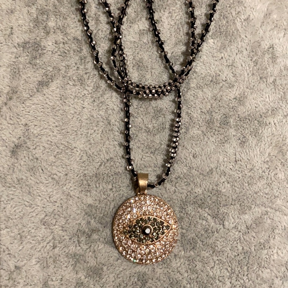 Evil eye necklace on a beaded long string